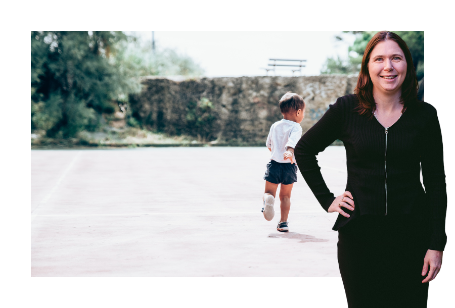 Karlene Wightman wearing a long sleeve black dress standing in front of a stock picture of a young toddler aged child, wearing a white top and dark shorts running around with white shoes on.